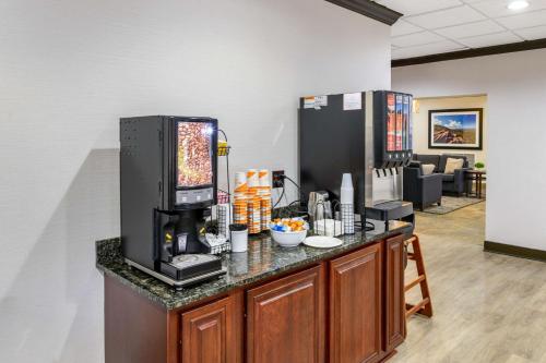 a counter with a coffee maker on top of it at Comfort Inn Monticello in Charlottesville