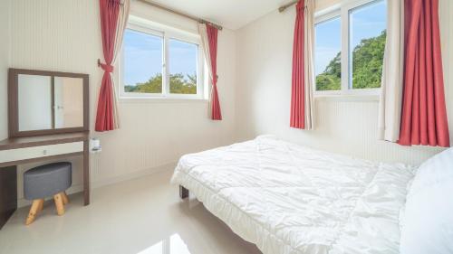 Katil atau katil-katil dalam bilik di Gapyeong Rialto Pension