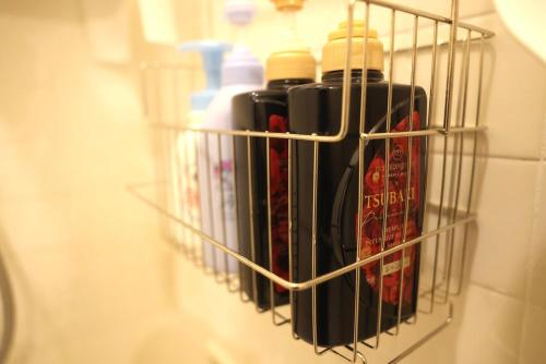 a bunch of bottles of wine in a rack at Sakuradai House in Ichihara