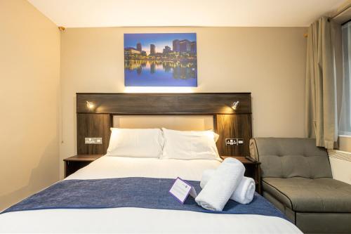 Postel nebo postele na pokoji v ubytování Stay Inn Manchester
