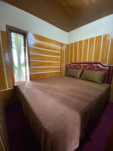 Postel nebo postele na pokoji v ubytování Homestay Nadiviya Alamendah