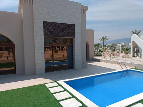 una representación de una villa con piscina en Luxury Redefined in Hawana Salalah, en Salalah