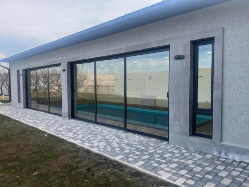 a building with large glass windows on the side of it at Rizo rest zone in Kotaykʼ