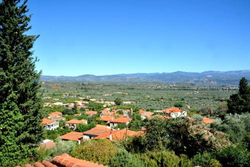 a view of a town with orange roofs at Elegant Stone Mansion in Historic Mystras in Mystras