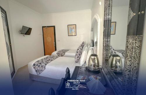 Una cama o camas en una habitación de Hotel Parador