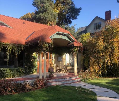 a house with an awning on the front of it at Mistiso's Place Vacation Rentals in Nelson