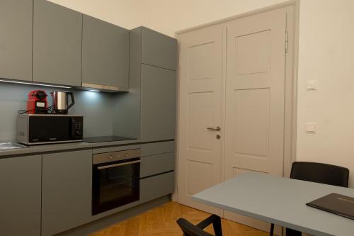 Kuchyň nebo kuchyňský kout v ubytování City Apartment Färbergasse Graz