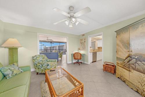 a living room with a couch and a ceiling fan at Sundial P401 in Sanibel