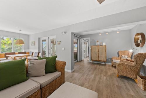 a living room with a couch and chairs at Rabbit Retreat in Sanibel