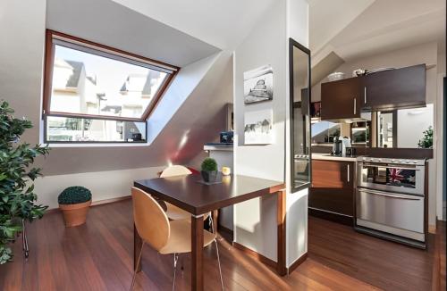 Kuchyň nebo kuchyňský kout v ubytování Appartement Newport vue mer