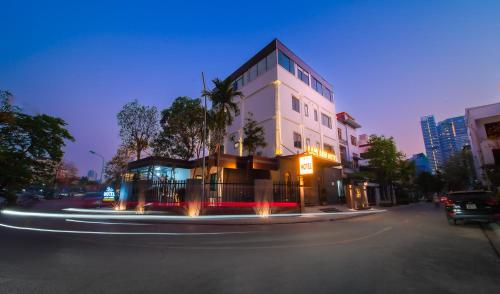 a building on a city street at night at Lam Anh Hotel 8 Ngoại Giao Đoàn BT3-10 in Hanoi