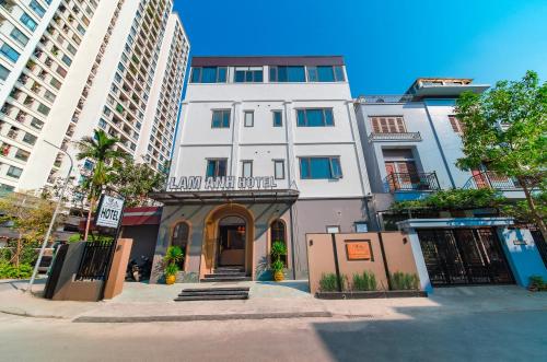 a white building with a sign that reads hotel allianceuce at Lam Anh Hotel 8 Ngoại Giao Đoàn BT3-10 in Hanoi