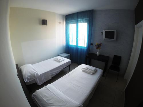 מיטה או מיטות בחדר ב-B&B Via Gallipoli