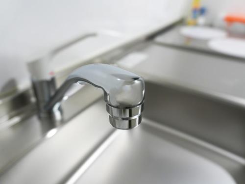 a kitchen sink with a chrome kitchen faucet at OUCHI HOTEL Onaganishi in Hiroshima