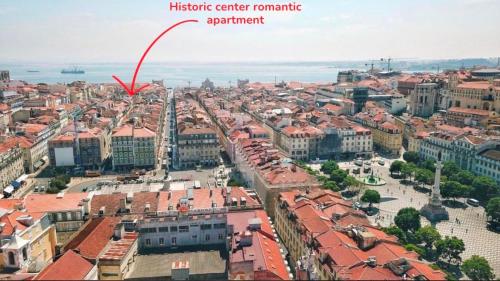 an aerial view of a city with a red arrow at Historic Center romantic apartment in Lisbon