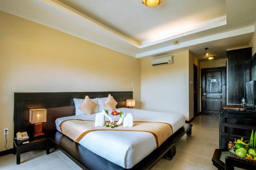 Postel nebo postele na pokoji v ubytování Romana Resort & Spa