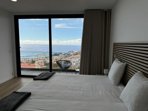 Ένα ή περισσότερα κρεβάτια σε δωμάτιο στο Bela Vista Funchal Villa