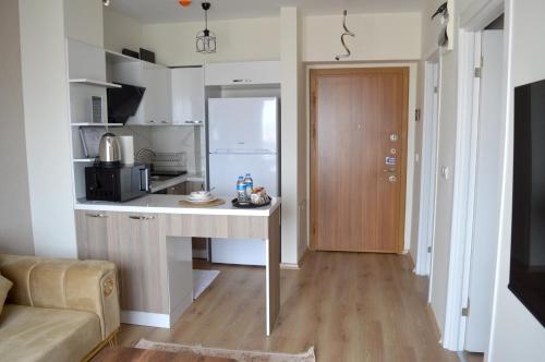 a small kitchen with a desk in a room at Classic Suite MS34 in Istanbul