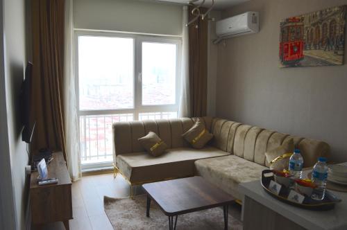 a living room with a couch and a table at Classic Suite MS34 in Istanbul