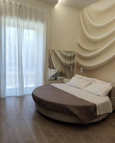 Ένα ή περισσότερα κρεβάτια σε δωμάτιο στο B&B Chapeau