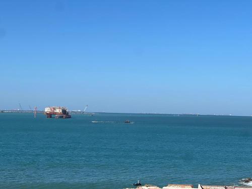 a large body of water with a ship in it at La mer Hotel in Alexandria
