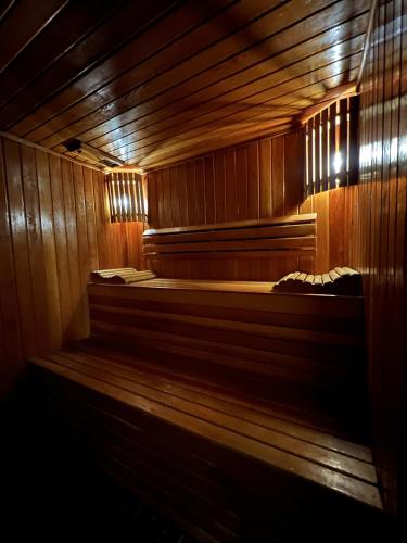 a wooden sauna with two beds in it at Le Riad Palais d'hotes Suites & Spa Fes in Fès