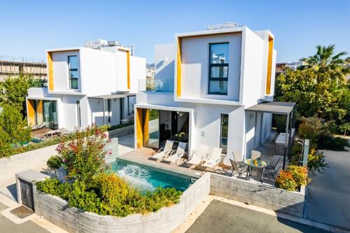 an aerial view of a house with a swimming pool at Villa Laurus 2 by Ezoria Villas in Paphos