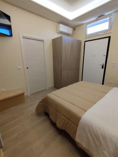 Ένα ή περισσότερα κρεβάτια σε δωμάτιο στο B&B Chapeau