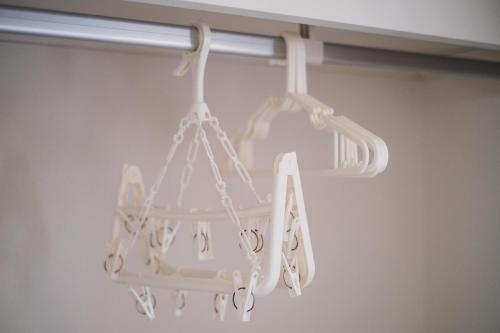 a white chandelier hanging from a ceiling at Odysis Onna Resort Hotel in Onna