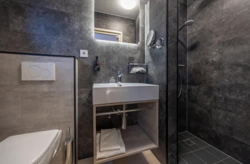Un baño de Fletcher Parkhotel Val Monte