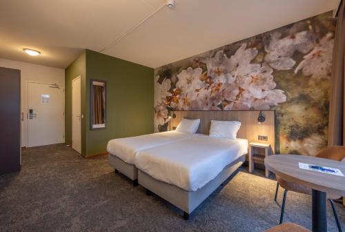 Postel nebo postele na pokoji v ubytování Fletcher Parkhotel Val Monte