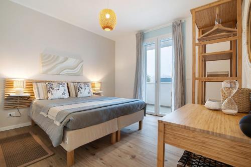 Katil atau katil-katil dalam bilik di Residence Blumar Jesolo Golf Club