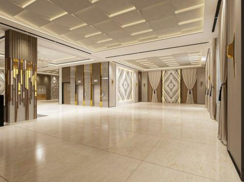 a large room with a ballroom with wooden walls at The Paradise Bliss - A Luxury Hotel & Spa in Udaipur in Udaipur