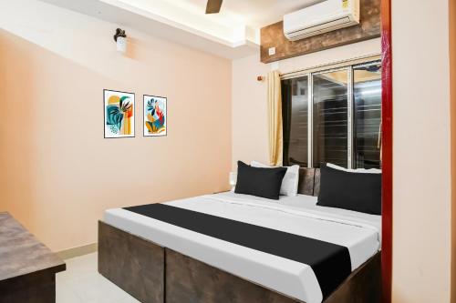 Postel nebo postele na pokoji v ubytování Super Hotel O MOHAR KUNJHA