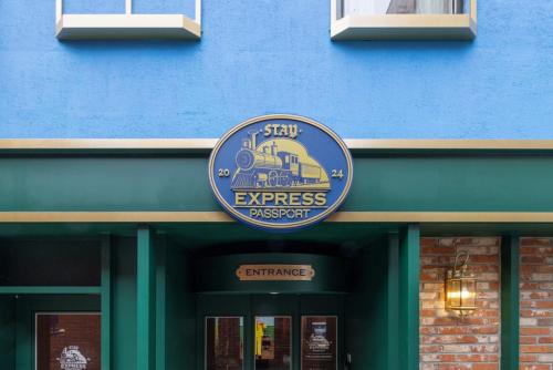 a blue building with a sign for a train on it at Stay Passport Express Spa Dangsan in Seoul