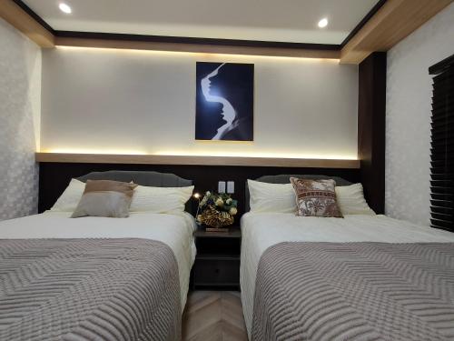 Katil atau katil-katil dalam bilik di 12全新装修 5室1厅2浴室2卫生间 设施齐全 最大12人 5 rooms 1dining room 2 bathrooms 2toilets Max 12P 免费无线网络