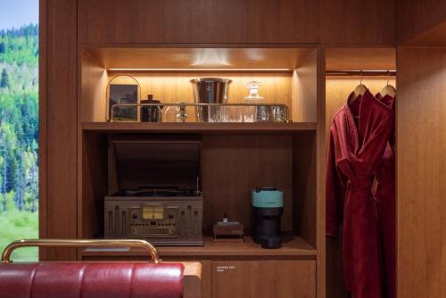 a room with a kitchen with a stove and a cupboard at Stay Passport Express Spa Dangsan in Seoul