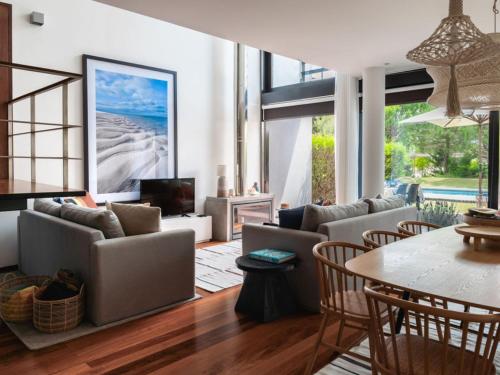 a living room with a couch and a table at Pool Beach & Golf Troia Reserve V3 in Troia