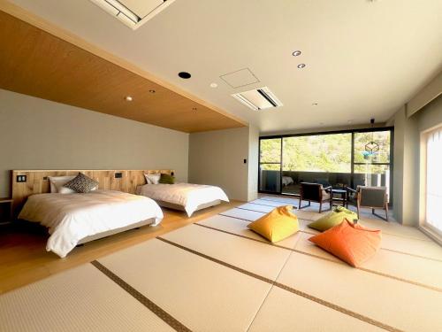 Postel nebo postele na pokoji v ubytování Hotel Yunomoto