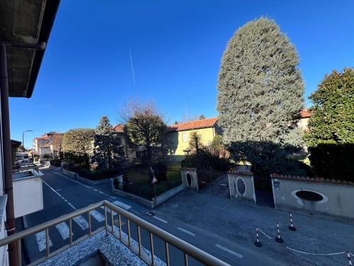 a view from a balcony of a street with trees at Brianza Home in Giussano