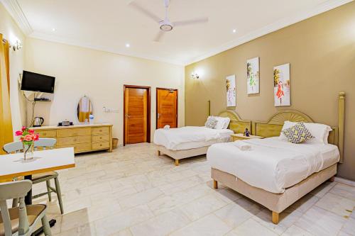 Voodi või voodid majutusasutuse Ocean Villa Heights toas