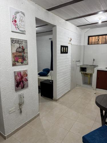 a room with a bathroom with a sink and a table at Acogedor Aparta estudio central 104 in Popayan