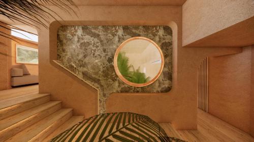 a room with a mirror on the wall and a staircase at La Gaia - Adult Only in Alanya