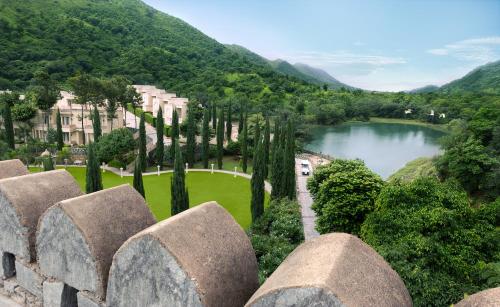 a view of a park with a lake and trees at Raajsa Kumbhalgarh - IHCL SeleQtions in Kumbhalgarh