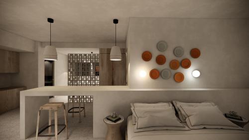 a bedroom with a bed and a kitchen with a table at La Gaia - Adult Only in Alanya