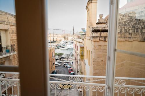 a view of a city street from a window at Grand Arcanum Apartment 2 - Comfortable and Elegant in Senglea