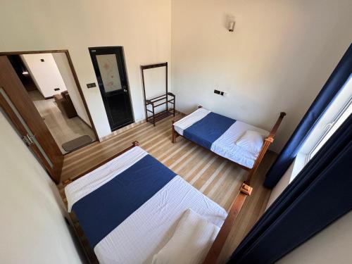 Postel nebo postele na pokoji v ubytování Aruna homestay