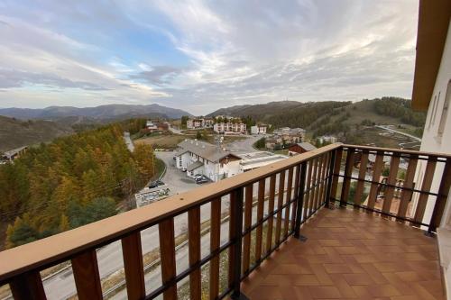 a balcony with a view of a town at 06CM - Very nice T2 on the heights of Valberg in Péone