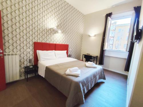 Postel nebo postele na pokoji v ubytování Milazzo23 Guesthouse