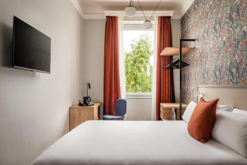 Ένα ή περισσότερα κρεβάτια σε δωμάτιο στο BYPILLOW Goldoni